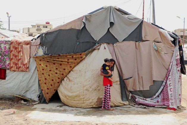 Una familia que vive en un campamento en Baghdad, Iraq, explicó que las tiendas de campaña no estaban preparadas para el invierno. Crédito: WFP/Mohammed Al Bahbahani.