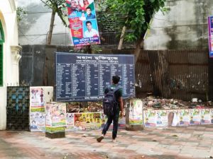 A student walks by a board displaying names of freedom fighters. The New Digital Security Act 2018 makes speaking against any freedom fighter leader a punishable offence. Credit: Stella Paul/IPS